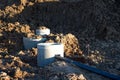 Laying concrete manholes and drain pipes for stormwater system. Connecting a trench drain to a concrete sewer wells Royalty Free Stock Photo