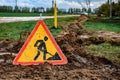 Laying a fiber optic cable for fast internet, electricity and telephone cable along a new street. Royalty Free Stock Photo