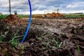 Laying a fiber optic cable for fast internet, electricity and telephone cable along a new street. Royalty Free Stock Photo