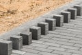 Laying floor tile sidewalk urban road or repairing paving stone slabs at a construction site Royalty Free Stock Photo