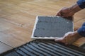 Laying floor tiles, improves the adhesion