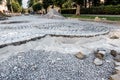 Laying granite cubes stone pavement on the a city street