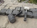 Laying granite paving stones - two rubber mallets close-up