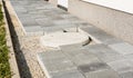 Laying gray concrete paving slabs in house courtyard driveway pa Royalty Free Stock Photo