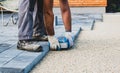 Laying gray concrete paving slabs in house courtyard driveway pa Royalty Free Stock Photo