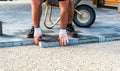 Laying gray concrete paving slabs in house courtyard driveway pa