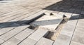 Laying gray concrete paving slabs in house courtyard driveway pa Royalty Free Stock Photo