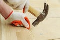 Laying hardwood parquet.