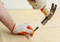 Laying hardwood parquet.