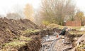 Laying of high-voltage cable lines in the earth trench Royalty Free Stock Photo