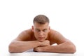 Laying muscular male looking at you Royalty Free Stock Photo