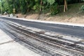 Laying a new asphalt on the road. Layer of fresh hot asphalt on the street Royalty Free Stock Photo