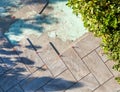 Laying outdoor flooring with the use of red spacers for the joints