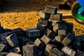 Cobblestones in a pile, on the sand.