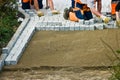 Laying paving bricks on soil Royalty Free Stock Photo