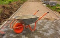 Laying of paving slabs. Repairing sidewalk. wheelbarrow Royalty Free Stock Photo