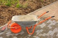 Laying of paving slabs. Repairing sidewalk. wheelbarrow. Royalty Free Stock Photo