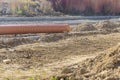 Laying pipes under the road culvert during road construction