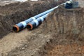 Laying or replacement of underground storm sewer pipes. Installation of water main, sanitary sewer, storm drain systems in city. Royalty Free Stock Photo