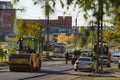 laying the roadbed on Krupskaya street in the city of Bratsk on a summer day