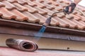 Laying of roofing felt from the roll with a flame from the burner close-up