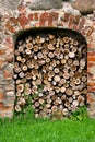 Laying of sawn firewood in the doorway of the old manor.