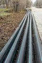 Laying of the sprinkler system of the pipeline in the ground trenches for the underground irrigation system, irrigation Royalty Free Stock Photo