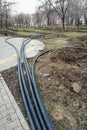 Laying of the sprinkler system of the pipeline in the ground trenches for the underground irrigation system, irrigation Royalty Free Stock Photo