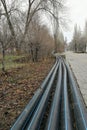 Laying of the sprinkler system of the pipeline in the ground trenches for the underground irrigation system, irrigation Royalty Free Stock Photo