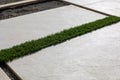 Laying of synthetic grass for walkway outdoors