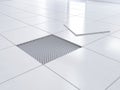 Laying tiles concept. Laying the ceramic tile on the floor Royalty Free Stock Photo