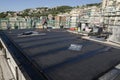 Laying of waterproofing sheathing and insulation on a roof