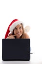 Laying woman with christmas hat and notebook Royalty Free Stock Photo
