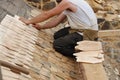 Laying wooden roof tiles