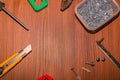 Layout for the carpenter. On a wooden surface, working tools in a circle, a copy of the space in the middle Royalty Free Stock Photo