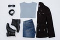 Layout clothes. Black jacket, boots, belt, glasses, jeans and gray T-shirt. View from above. White background Royalty Free Stock Photo