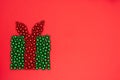 Layout made of red and green shiny glitter balls laid out in the shape of a Christmas gift on a red background. Happy Royalty Free Stock Photo