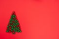 Layout made of red and green shiny glitter balls laid out in the shape of a Christmas tree on a red background. Happy Royalty Free Stock Photo