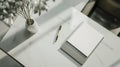 layout of office desk,top view,background is made in modern theme in light colors,diary,elegant pen,plant,empty space for text, Royalty Free Stock Photo