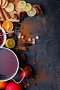Layout of, a pan with a mulled wine, a board with apples, lemon and dates Royalty Free Stock Photo