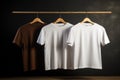 Layout of white and brown T-shirts on a hanger Royalty Free Stock Photo