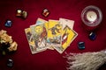 lays out tarot cards, candle, crystal on red background Flat lay Top view Fortune telling, prediction, esoteric, tarot cards