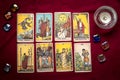 lays out tarot cards, candle, crystal on red background Flat lay Top view Fortune telling, prediction, esoteric, tarot cards