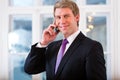 Laywer or Businessperson in Office on the phone Royalty Free Stock Photo