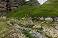 LAZA, AZERBAIJAN - JUNE 16, 2018: People visit waterfall in Laza village in Caucasus mountains, Azerbaij