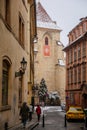 Lazenska street, Stone gothic and romanesque Church of Our Lady beneath the Chain, maltese quarter, snow in winter day, Mala
