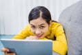 Lazy asian girl lying rest at home on sofa in living room feeling exhaustion having day nap lack of energy, after being detained Royalty Free Stock Photo