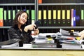 Lazy asian office woman using mobile smart phone in working time