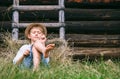 Lazy boy lies in grass under the barn - careless summer on count