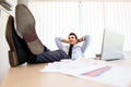 Lazy businessman put his legs on the desk Royalty Free Stock Photo